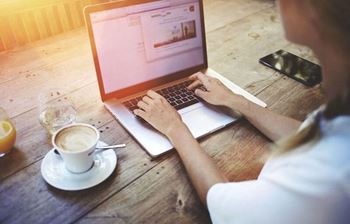 Bdx at capital village | woman on laptop drinking coffee